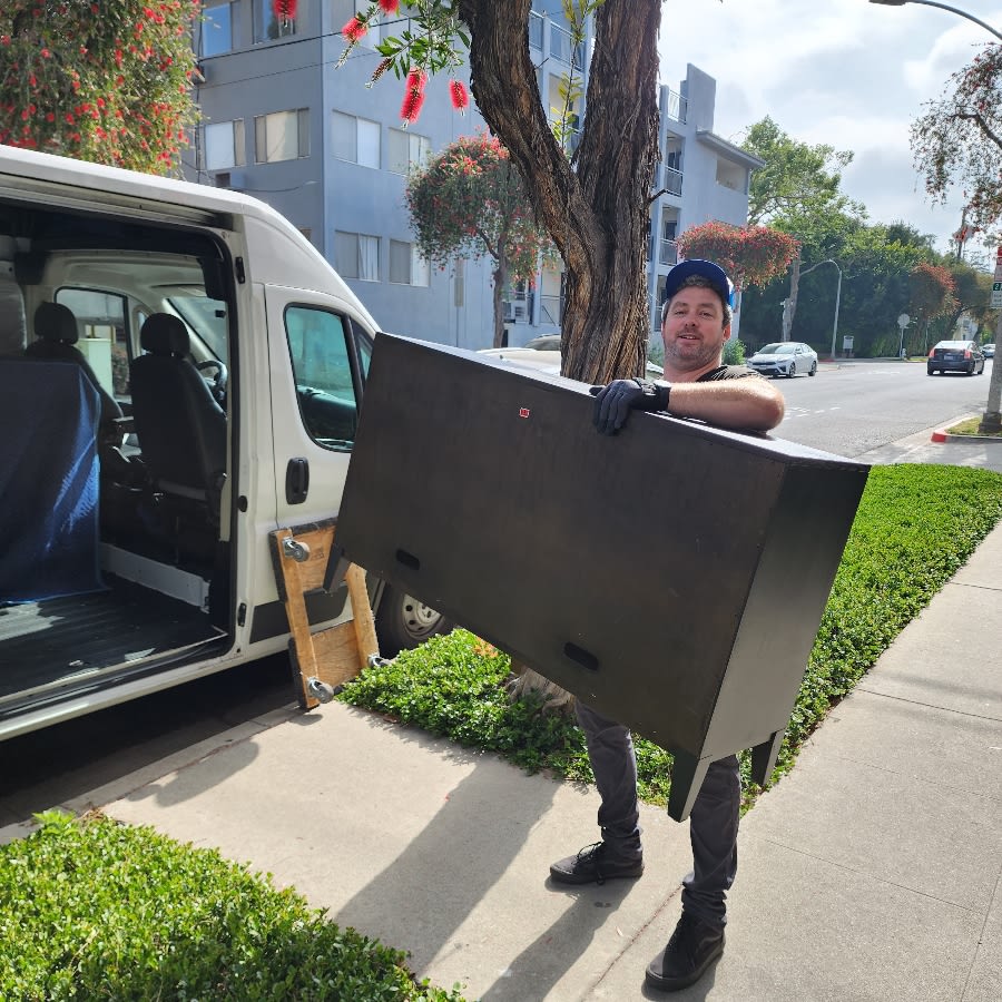 Man lifting Dresser